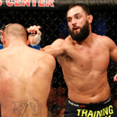 Johny Hendricks punches Robbie Lawler during their UFC welterweight title fight. (Getty)