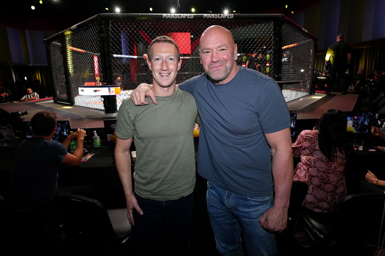 Dana White poses for a photo with Facebook CEO Mark Zuckerberg at the UFC Apex.