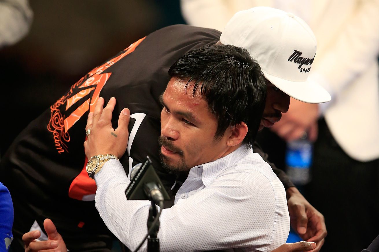 Manny Pacquiao and Floyd Mayweather hug it out after their 2015 fight in Las Vegas. 