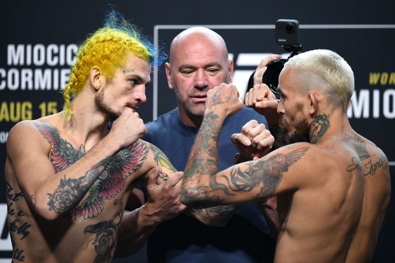 Sean O’Malley and Marlon Vera at weigh-ins for UFC 252. 