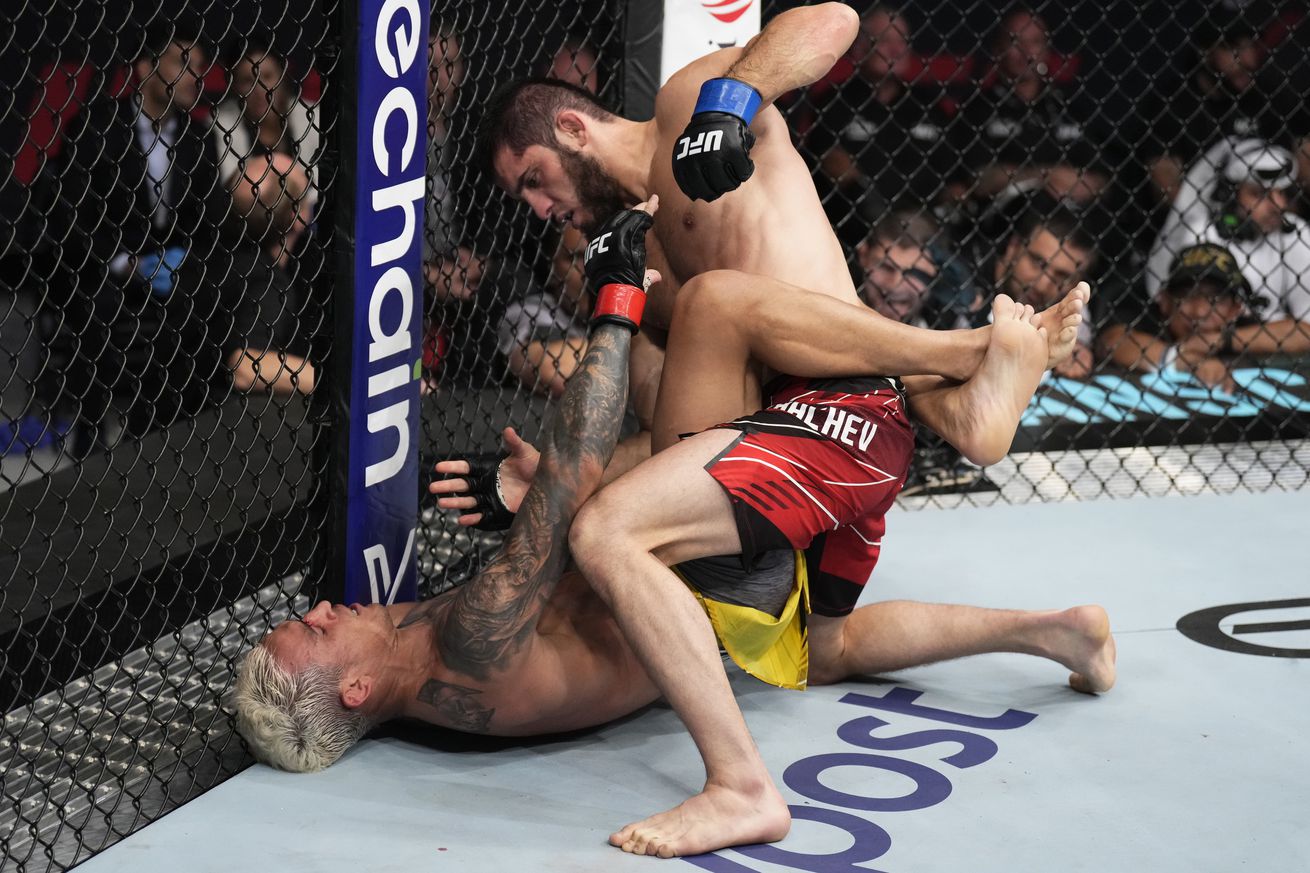 Charles Oliveira fights off his back against Islam Makhachev at UFC 280.