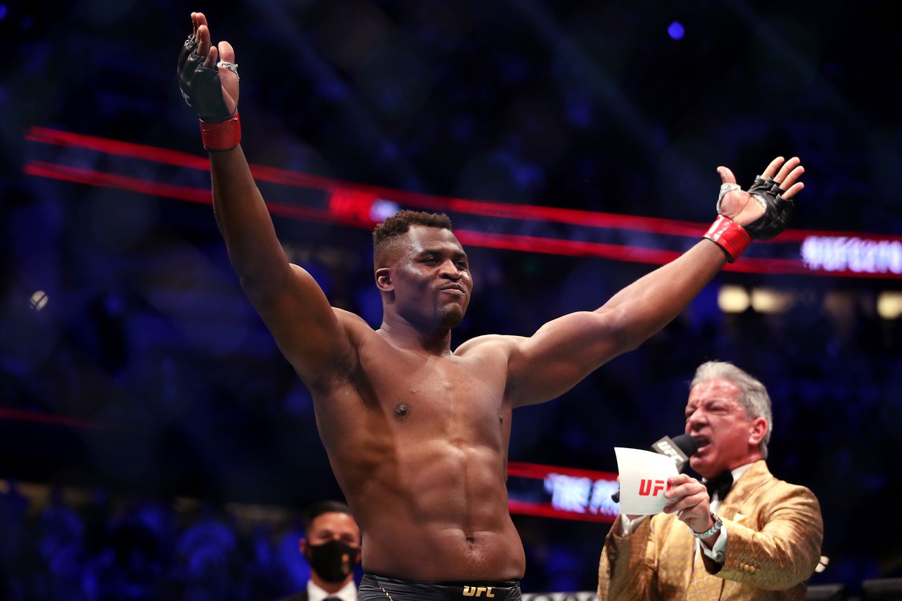 Francis Ngannou poses for the crowd ahead of his title fight at UFC 270.