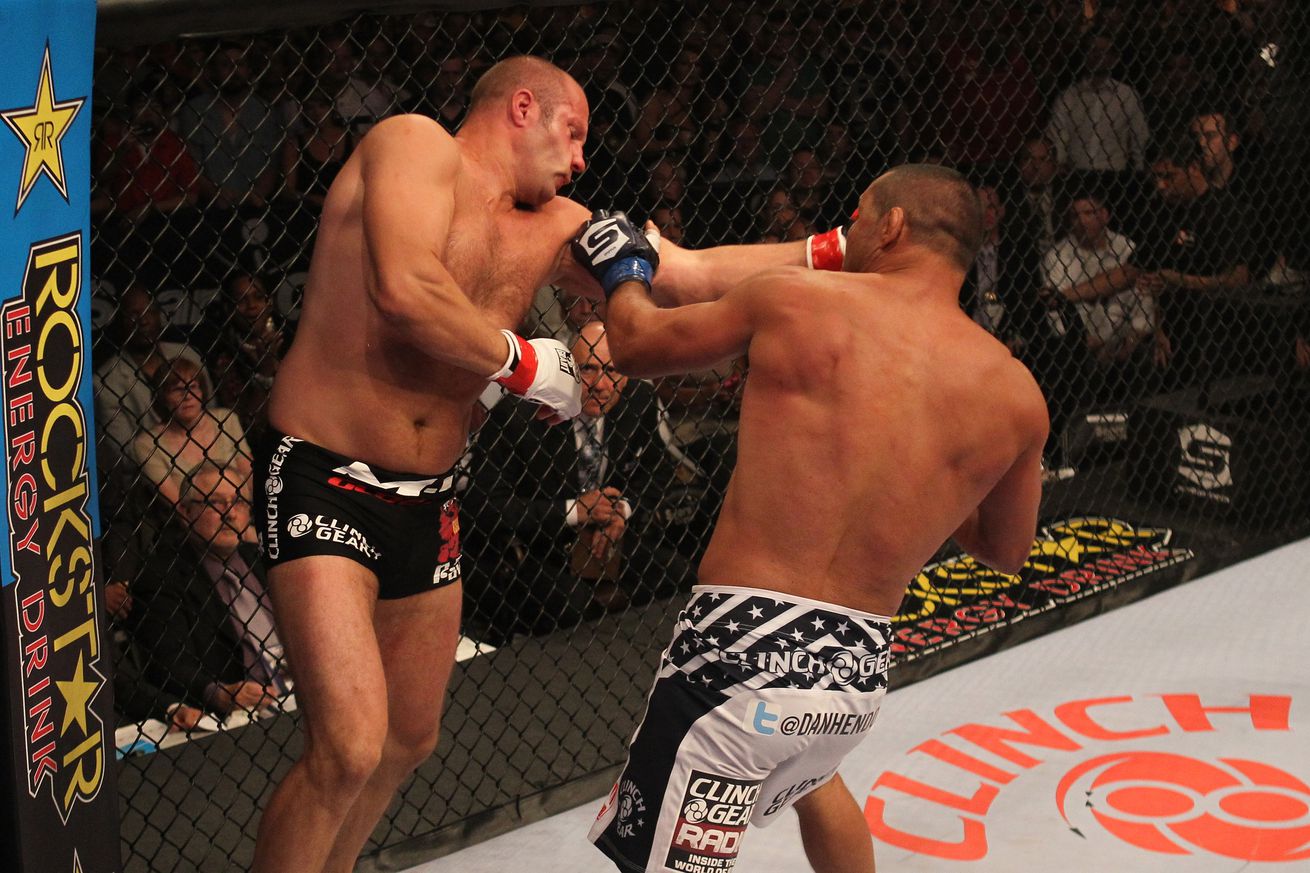 Dan Henderson lands a left hand on Fedor Emelianenko in a 2011 Strikeforce event.