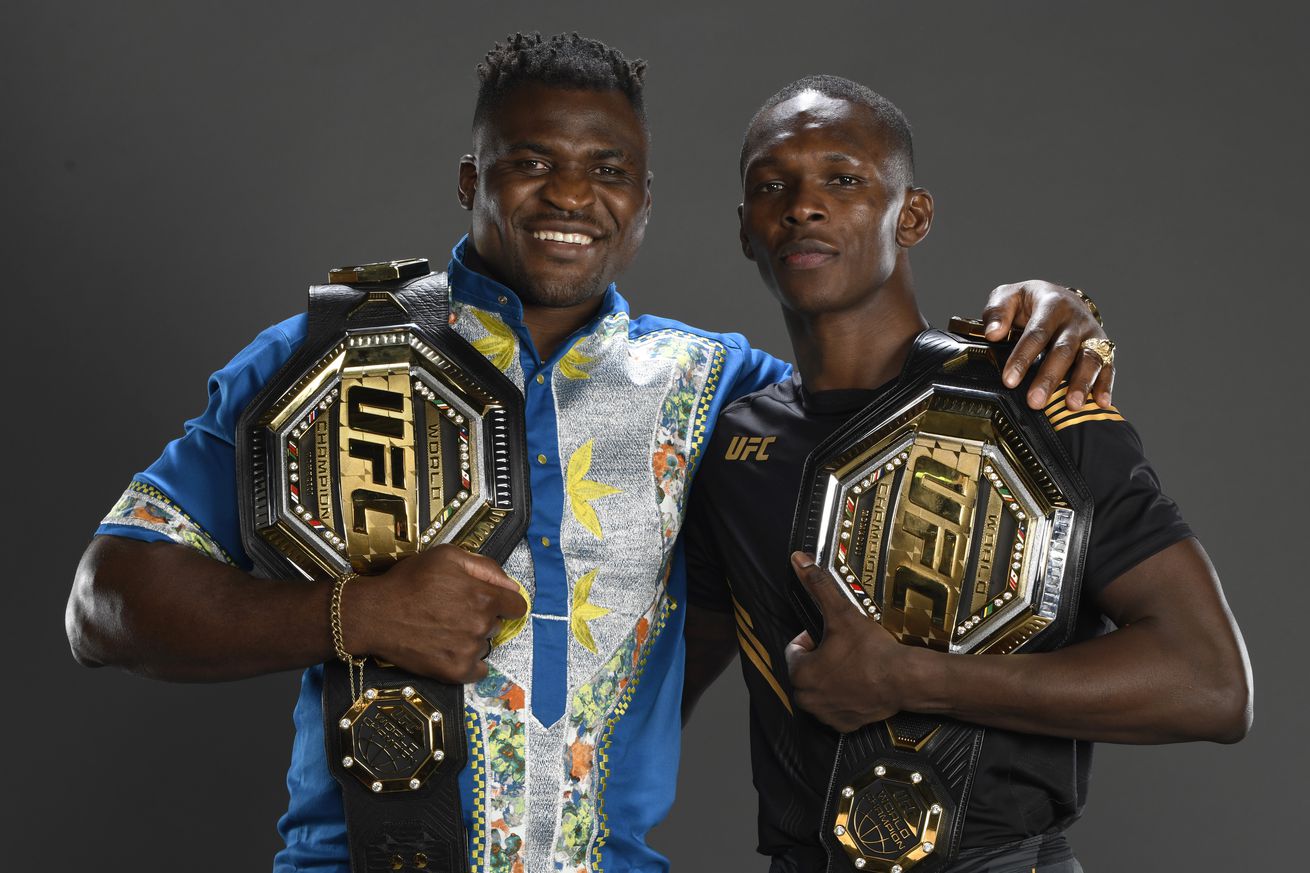 Francis Ngannou and Israel Adesanya pose for a photo after UFC 263.