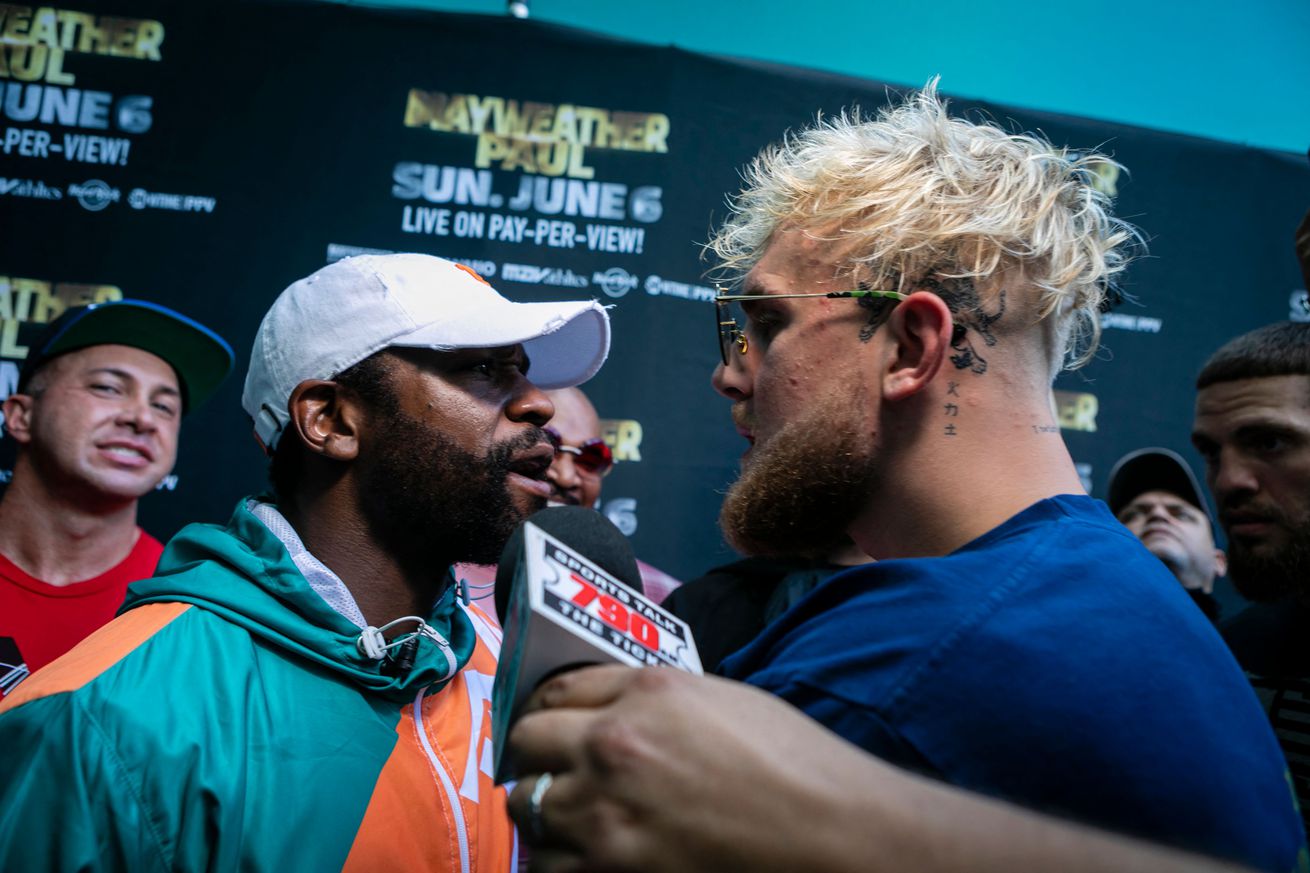 Jake Paul and Floyd Mayweather during a press event.